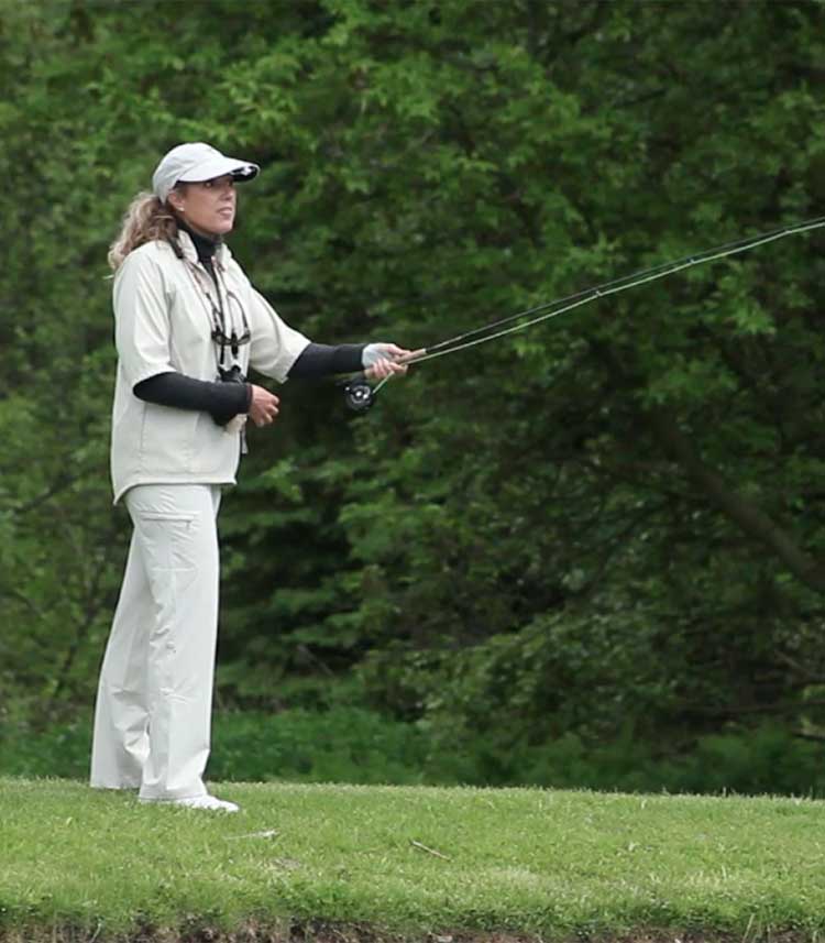 Connie using a fishing rod - fishing club professional